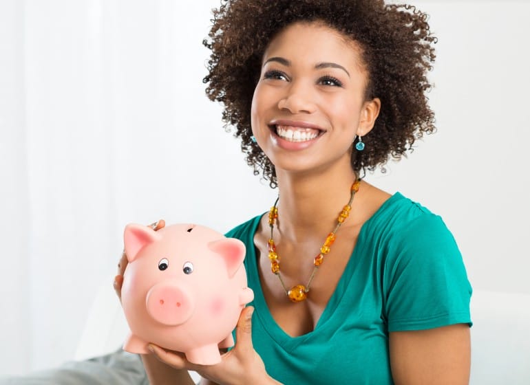 Woman holding a piggy bank
